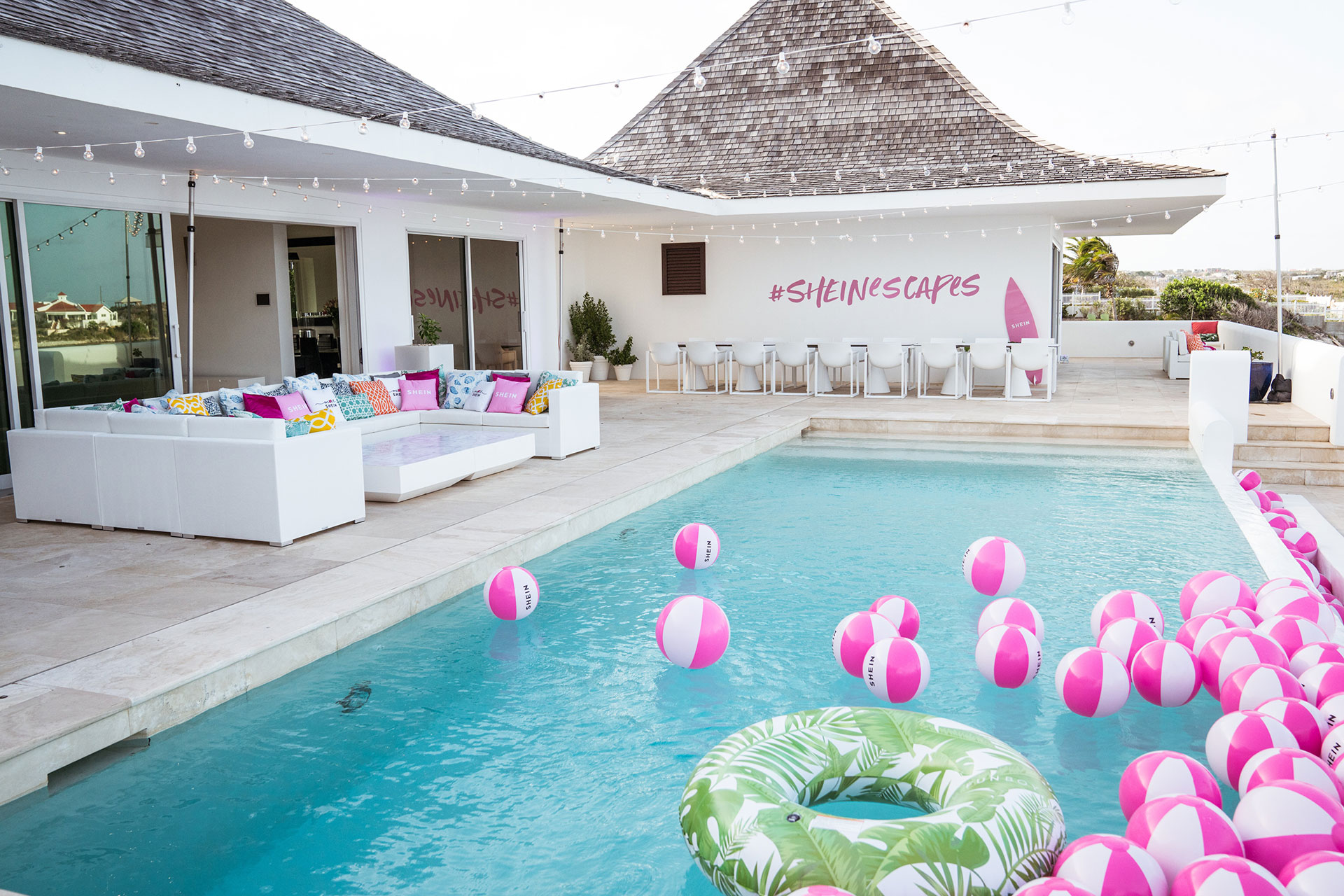 Poolside with pink beach balls at the SHEIN Influencer trip