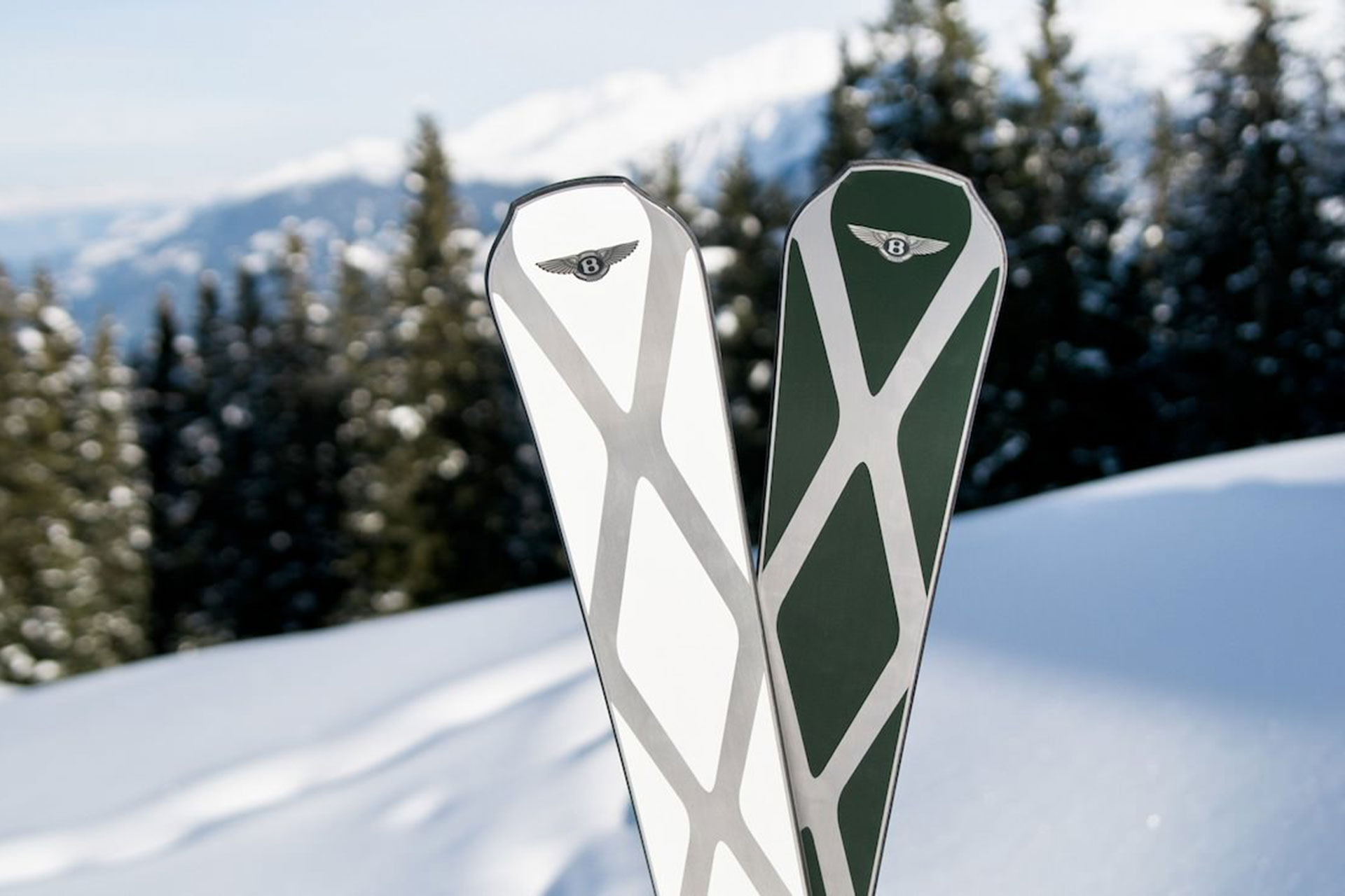 Close up of a pair of Bomber Skis with Telluride as the backdrop